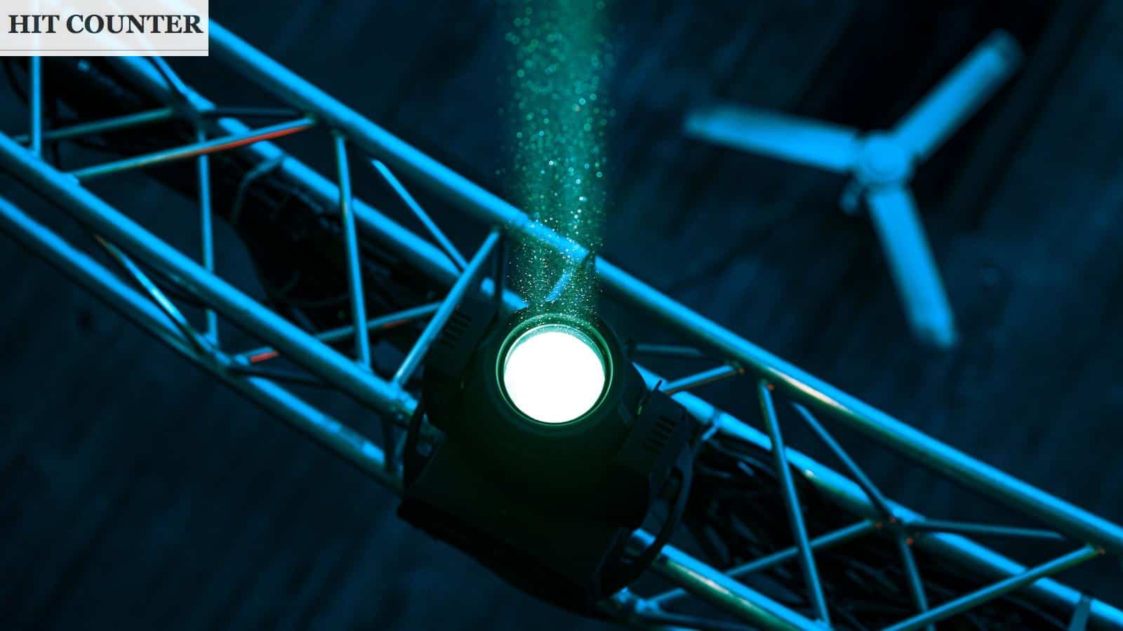 a green light is shining on a stage