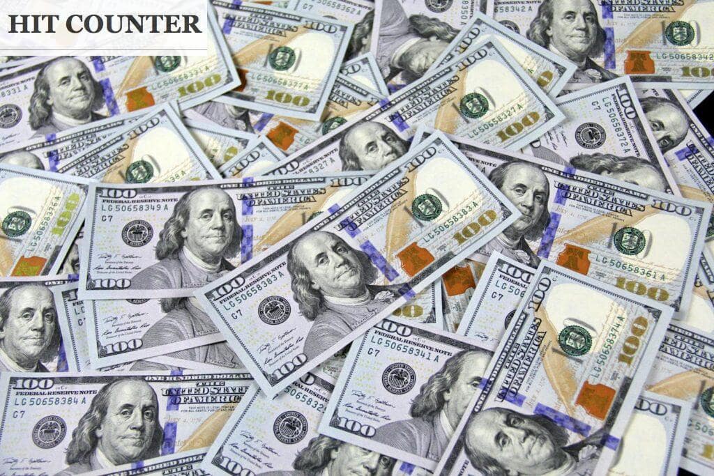 Pile of US hundred dollar bills depicting financial success and wealth.