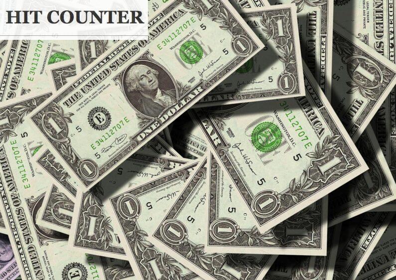 Close-up of scattered US dollar bills symbolizing finance and wealth.