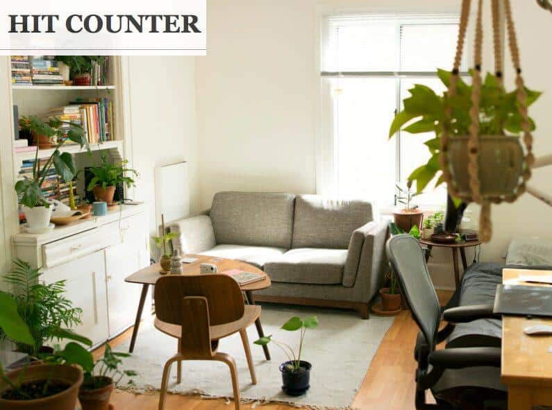 gray fabric loveseat near brown wooden table